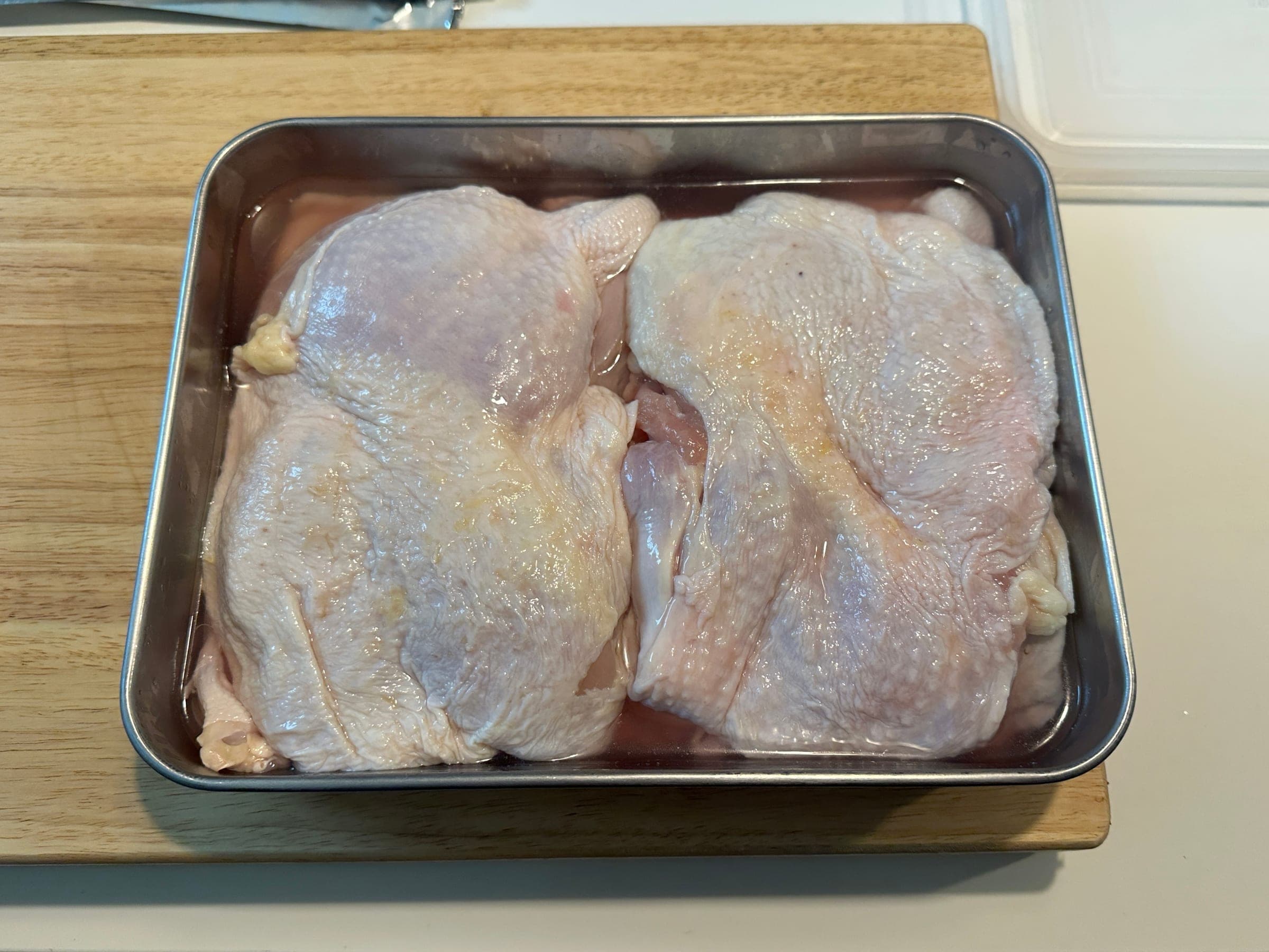Chicken marinating in rice wine