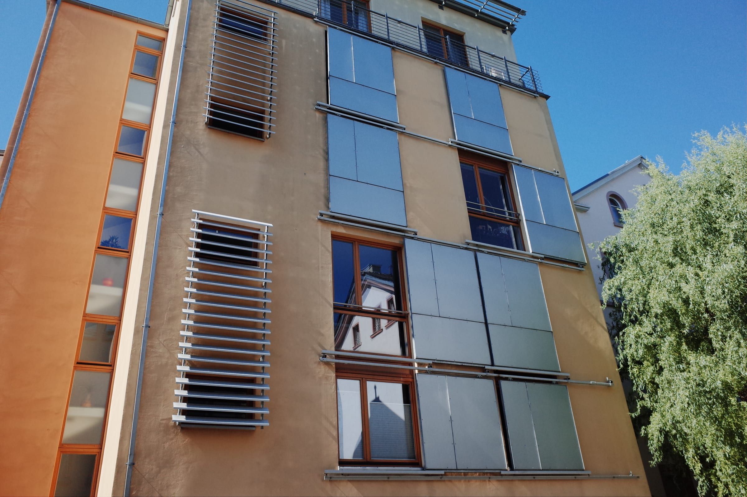 Sliding metal shutters on a building facade